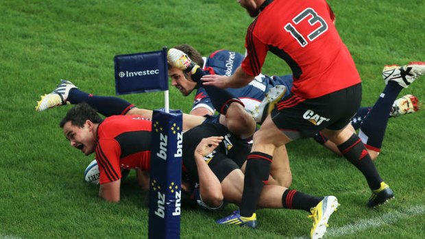 Zac Guildford of the Crusaders scores a try in the third minute.
