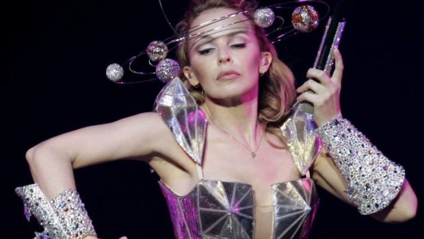 Kylie Minogue plans to give up singing and has split with her manager.