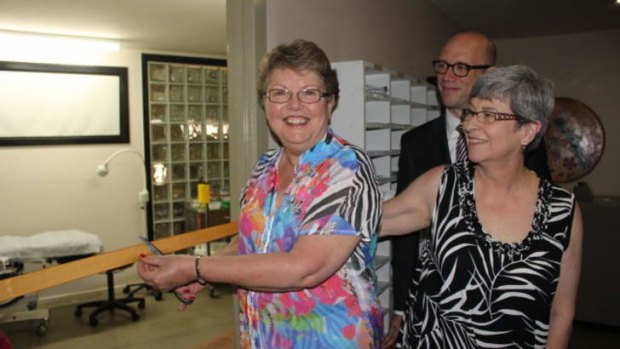 Shelley Argent, who donated $20,000 to transform the new premises into a medical clinic, cuts the ribbon at the transgender clinic's official opening.
