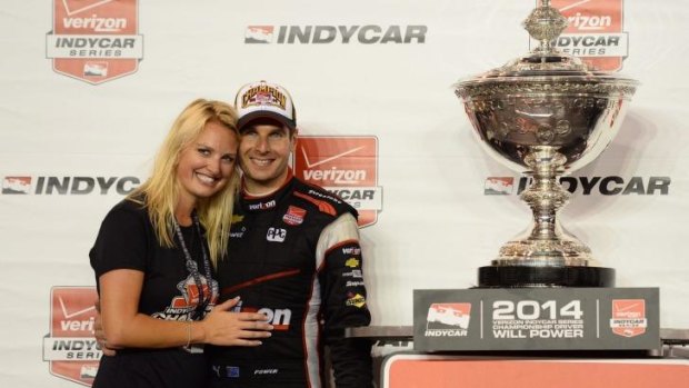 Champ: Will Power and his wife Elizabeth with the IndyCar trophy.