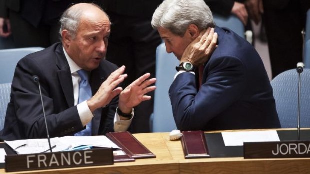 Committed: France's Foreign Affairs Minister Laurent Fabius (left) talks with John Kerry. France has flown its first sortie against Islamic State targets in Iraq.