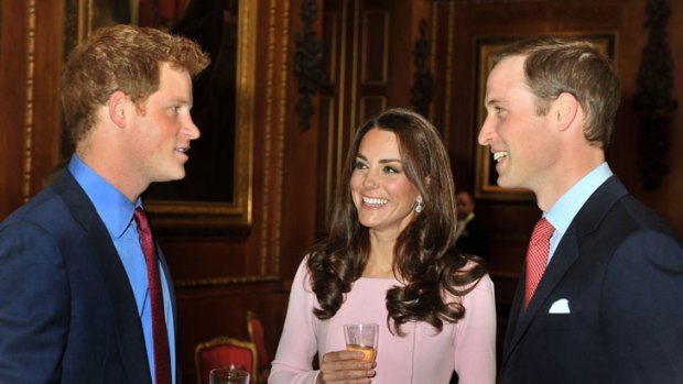 Prince William, right,  talks with his wife Catherine, Duchess of Cambridge and his brother Prince Harry recently.