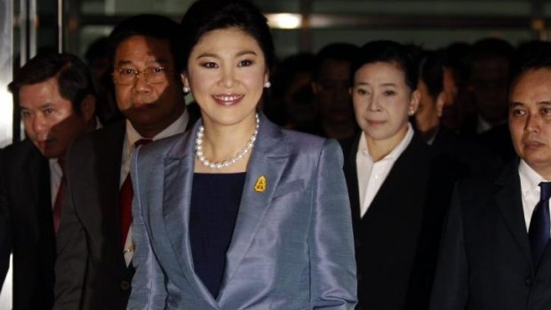 All smiles: Thailand's Prime Minister Yingluck Shinawatra arrives at the Constitutional Court in Bangkok May 6, 2014. Yingluck arrived at the Constitutional Court on Tuesday to defend herself against charges of abuse of power, one of two legal challenges that could see her removed from office this month. 