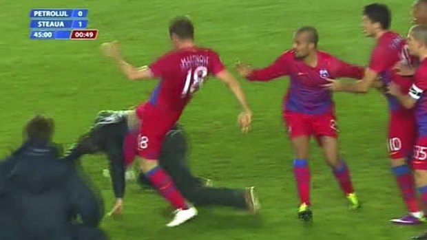 Backlash ... a Steaua Bucharest player kicks Dragos Petrut Enache.