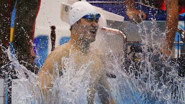 China's Sun Yang celebrates his world record in the men's 1500m freestyle.