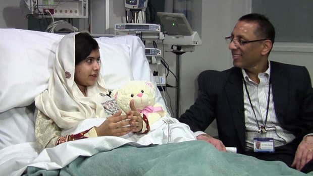 The Pakistani schoolgirl shot in the head by the Taliban, Malala Yousafzai, speaks following her operation to critical care consultant Dr Mav Manji at the Queen Elizabeth Hospital in Birmingham.