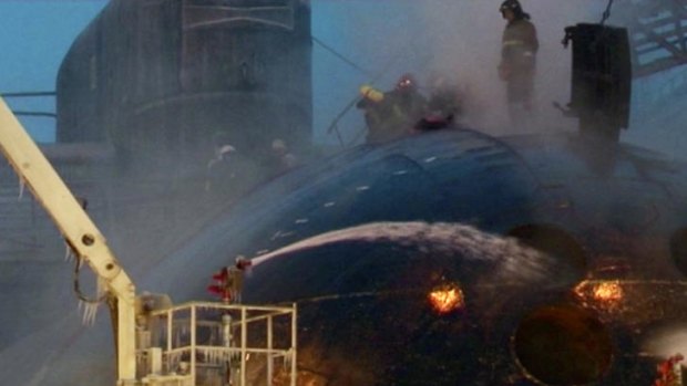 Firemen battle the blaze aboard the Yekaterinburg.