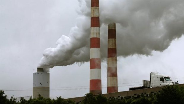 Under pressure to change ... Emissions spew out of a large stack at the coal-fired Morgantown Generating Station in Maryland.