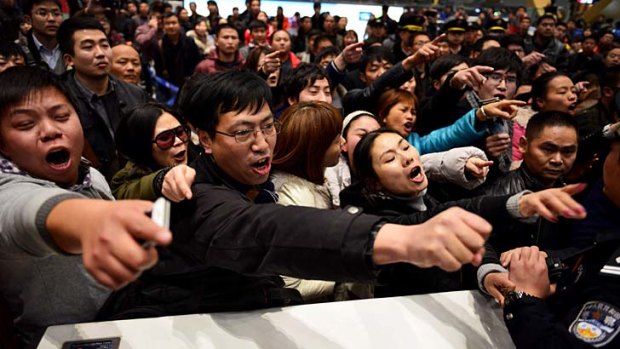 Angry passengers ... massive delays stranded thousands in Kunming this month.