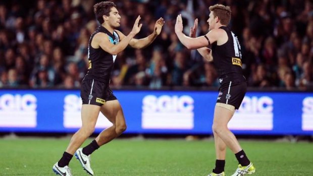 Chad Wingard and Matthew White celebrate another Port goal.