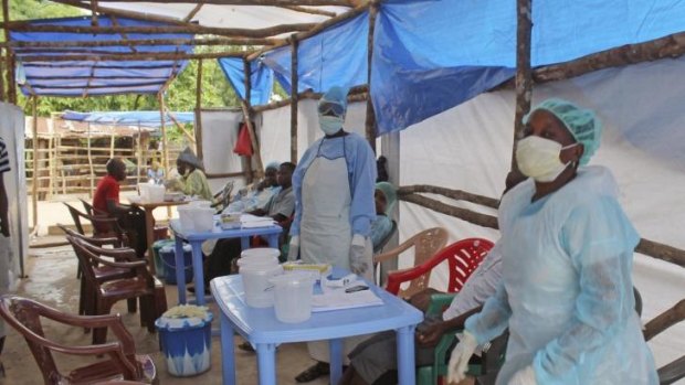 Medical personnel inside a clinic taking care of Ebola patients in the Kenema District on the outskirts of Kenema, Sierra Leone.