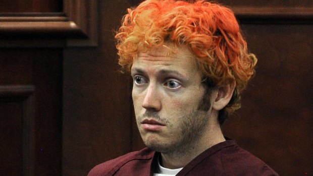 Silent: James Holmes at the court hearing during which he was told he would remain in solitary confinement.