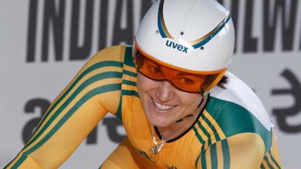 All smiles . . . Anna Meares wins gold.