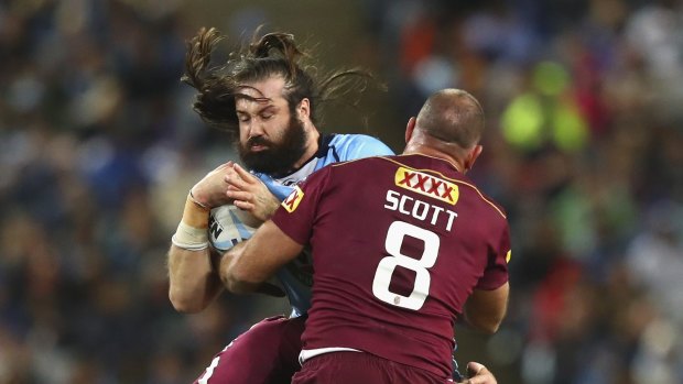 Up front: Aaron Woods collides with Matt Scott.