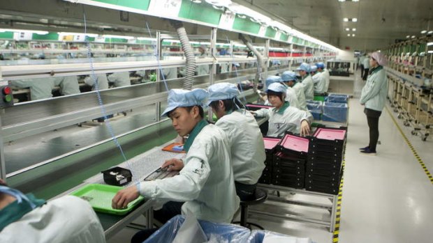 On the line: Workers assemble keyboards at the Logitech International factory in Suzhou, Jiangsu province.