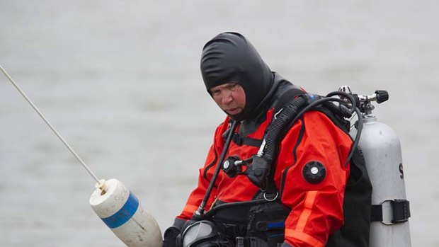 A police diver searches for human remains.