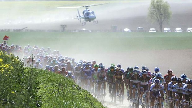 Cobblestones below, dust everywhere else . . . the peloton in the Paris-Roubaix one-day, 258 kilometres race - known as "the Hell of the North" wends its way across northern France on Sunday.