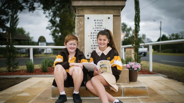 Mount Hunter public school students Issac Latham and Chantel Wright with the book on local diggers researched by year 5 and 6 students.