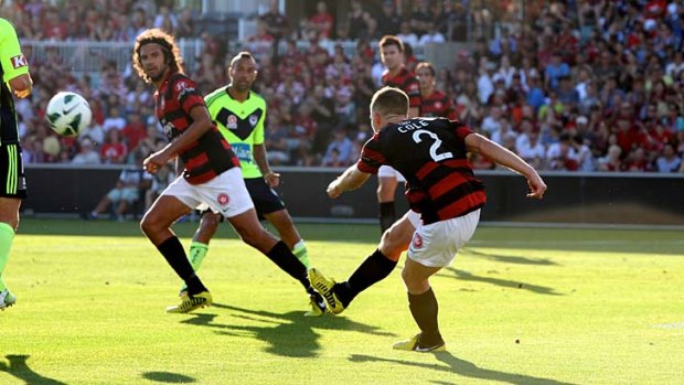 Heading uptown &#8230; fullback Shannon Cole begins a Wanderers counter attack.