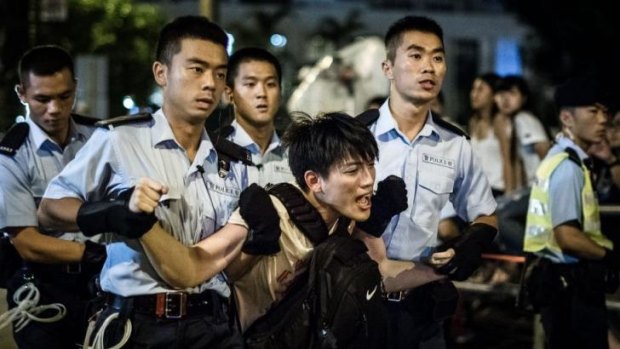 Police remove protesters in the central district: Pro-democracy rally.