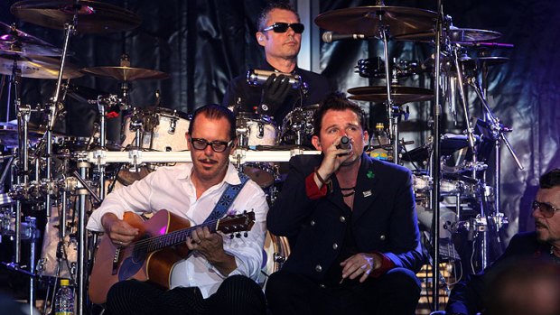 Kirk Pengilly (guitar), John Farriss (drums) and Ciaran Gribbin (vocals) during the band's Red Hot Summer Tour earlier this year.