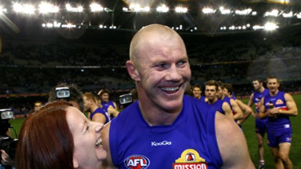 Favourite player ... Julia Gillard with Barry Hall after the Bulldogs thumped North Melbourne yesterday.