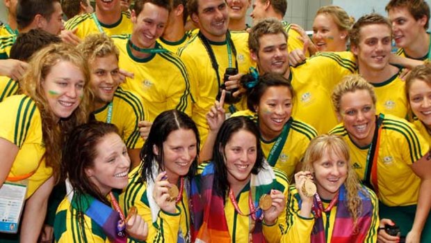The medley relay team (from left), Emily Seebohm, Leisel Jones, Alicia Coutts and Jessicah Schipper celebrate with the Australian team.