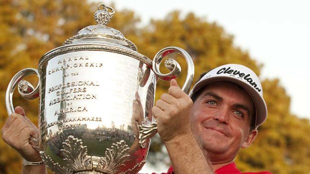 Keegan Bradley of the US holds the Wanamaker trophy after his play-off victory over Jason Dufner.