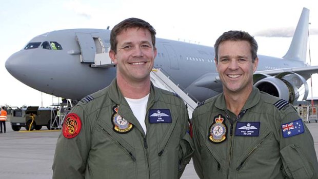 Pilots from No. 33 Squadron, Squadron Leader Craig "Fish" Whiting (left) with Squadron Leader Paul "Wombat" Bryan, stand proudly in front of the new KC-30.