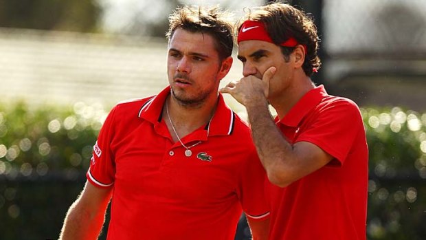 Stanislas Wawrinka and Roger Federer during their Davis Cup doubles match against Lleyton Hewitt and Chris Guccione.