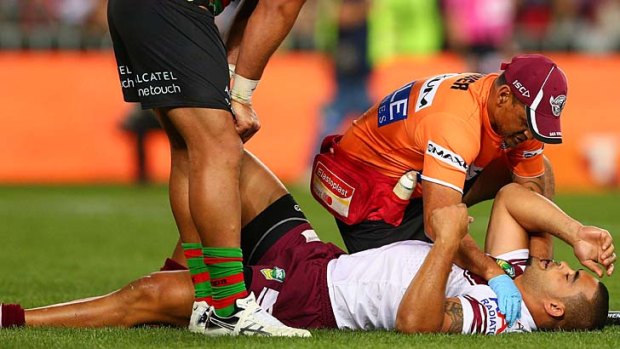 Richie Fa'aoso receives attention after injuring his neck against Souths in the NRL Preliminary Final.