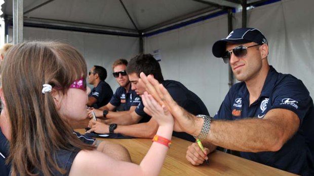 Chriss Judd meets young fans at Visy Park.