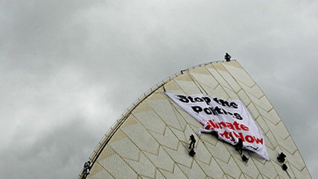 The protesters climbing the Opera House this morning.