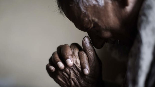 An elderly Pakistani Christian man prays during a Mass in Islamabad over Easter. Christians are among the country's most marginalised citizens.