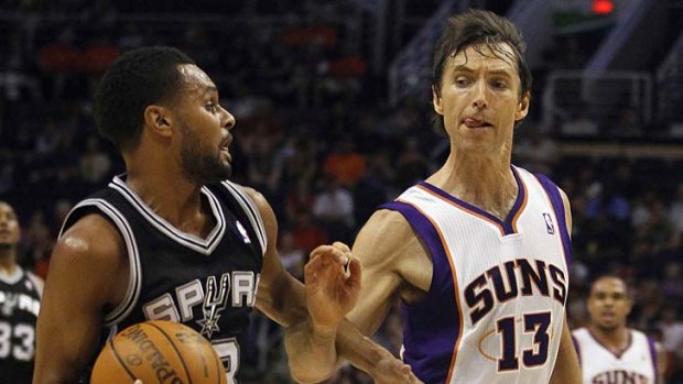 Rebound: Patty Mills (left) in action for the San Antonio Spurs.