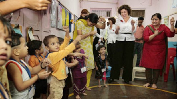 Therese Rein joins in the fun at Reality Cares Kindergarten in  Mumbai’s  Dharavi slum, the largest in India, with more than 1 million inhabitants.