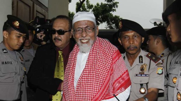 Radical Indonesian cleric Abu Bakar Bashir, a leader of the outlawed Southeast Asian militant network Jemaah Islamiah, arrives for his trial at the South Jakarta court in 2011.