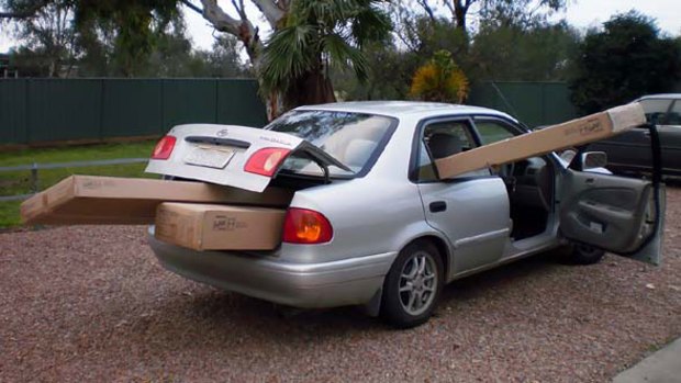 A Shepparton motorist has been fined for driving home with furniture hanging out his window and car boot.