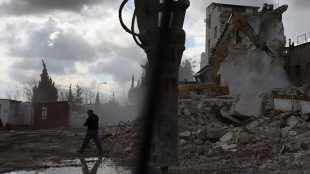 Israeli bulldozers demolish the Shepherd Hotel in East Jerusalem.