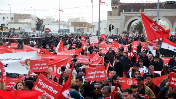 Protesters at an anti-extremism march, in Tunis on Sunday. Tens of thousands of Tunisians from across the political spectrum marched through the capital to denounce extremist violence after a deadly museum attack on foreign tourists. 