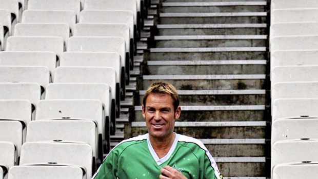 Back to the future: Shane Warne returns to the MCG yesterday, in a ''costume'' that doesn't impress Liz Hurley.