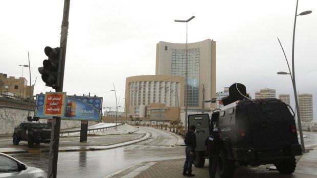 Security forces take up positions around Corinthia Hotel in Tripoli after it was attacked by gunmen.