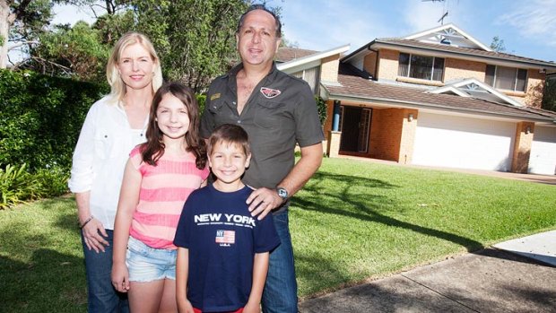 Family favourite... Jim Paras with his wife Nicolla and children Olivia and Yianni outside their new house at Kellyville. Photo: James Brickwood.