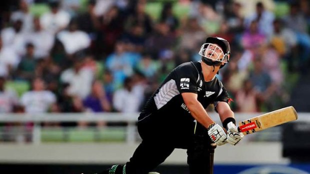 New Zealand's one-drop batsman Jesse Ryder sweeps uppishly during his innings of 83.