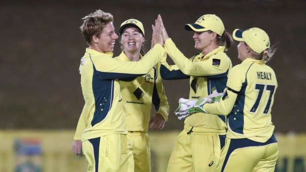 Elyse Villani of Australia celebrates with teammates after taking the wicket Chloe Tryon of South Africa during the One Day International in Coffs Harbour.