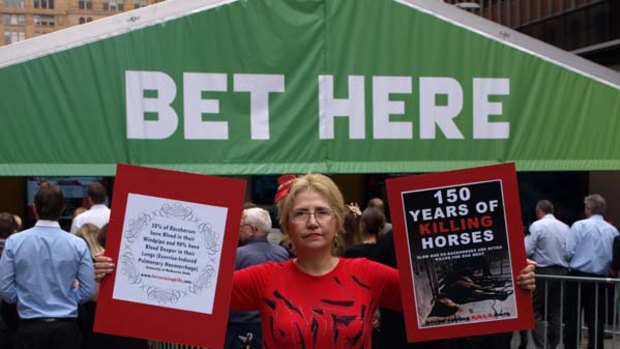 Activists take to the streets to protest against horse racing.