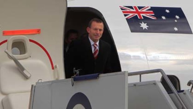 Tony Abbott arrives back in Canberra to begin negotiations to form government.