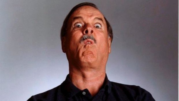 Harder than it looks: John Cleese pulls a funny face.