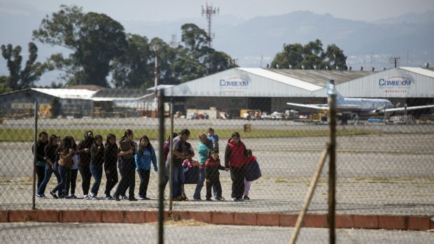Guatemalan migrants deported from the United States arrive at the processing center at an Air Force base in Guatemala City, Guatemala.