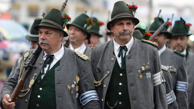 Bavarian riflemen in traditional costumes arrive for a salute shooting in front of the 'Bavaria' statue on the last day of the 184th Oktoberfest beer festival in Munich, Germany.